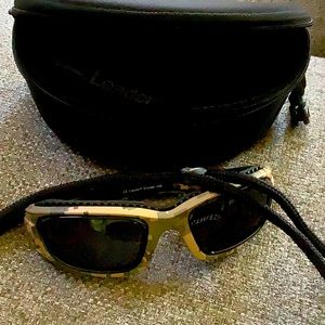 Leader, unisex sunglasses never worn! Green camouflage design.